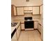 Bright kitchen with ample cabinetry and gas range at 5751 E Hacienda Ave # 118, Las Vegas, NV 89122