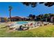Relaxing pool area with lounge chairs and a table at 5751 E Hacienda Ave # 118, Las Vegas, NV 89122