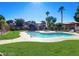 Refreshing community pool with grassy area at 5751 E Hacienda Ave # 118, Las Vegas, NV 89122