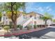Well maintained stucco building with landscaping at 6701 Squaw Mountain Dr # 203, Las Vegas, NV 89130