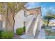 Building exterior with stairs leading to entrance at 6701 Squaw Mountain Dr # 203, Las Vegas, NV 89130