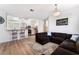 Open living room with L-shaped sectional sofa at 6701 Squaw Mountain Dr # 203, Las Vegas, NV 89130