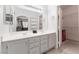 Double vanity bathroom with a large mirror and access to a walk-in closet at 6701 Squaw Mountain Dr # 203, Las Vegas, NV 89130
