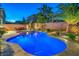 Relaxing pool area with night lighting, creating an inviting atmosphere at 6780 W Cougar Ave, Las Vegas, NV 89139