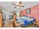 Spacious bedroom with ceiling fan and ample natural light at 7390 W Rome Blvd, Las Vegas, NV 89131