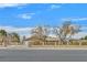 Single story home with landscaped yard and gated entrance at 7390 W Rome Blvd, Las Vegas, NV 89131