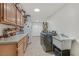Laundry room with cabinets, sink, and washer/dryer at 7390 W Rome Blvd, Las Vegas, NV 89131