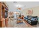 Open living room features hardwood floors and views into the kitchen at 7390 W Rome Blvd, Las Vegas, NV 89131