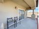 Cozy balcony with seating provides a relaxing outdoor space with neighborhood views at 7633 Winterthur Ct, Las Vegas, NV 89129