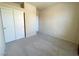 Bedroom features double closet doors, neutral carpet, and neutral paint at 7633 Winterthur Ct, Las Vegas, NV 89129
