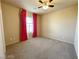 Standard bedroom with ceiling fan, carpeted floors, and a window at 7633 Winterthur Ct, Las Vegas, NV 89129