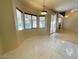 Inviting dining area with tile floors and a view to the pool area, creating a bright and airy atmosphere at 7633 Winterthur Ct, Las Vegas, NV 89129