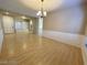 Open floorplan featuring laminate flooring and wainscoting, creating a spacious and inviting dining area at 7633 Winterthur Ct, Las Vegas, NV 89129