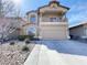 Charming two-story home with a balcony and a well-manicured front yard featuring desert landscaping at 7633 Winterthur Ct, Las Vegas, NV 89129