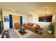 Upstairs living room features high ceilings with a plush couch, chair and decor at 7633 Winterthur Ct, Las Vegas, NV 89129