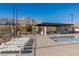 Relaxing pool area with shaded seating and BBQ grills at 888 Market Grove Ln, Las Vegas, NV 89138