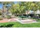 Picnic area with tables, benches, and shade trees at 8925 Medicine Wheel Ave, Las Vegas, NV 89143