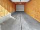 Empty garage interior with unfinished walls and concrete floor at 8985 S Durango Dr # 2023, Las Vegas, NV 89113