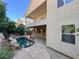 Covered patio, kidney-shaped pool, and lush landscaping at 9472 Ojibwa Ave, Las Vegas, NV 89149