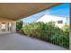 Covered balcony with view of backyard and neighboring homes at 9472 Ojibwa Ave, Las Vegas, NV 89149