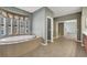 Spacious bathroom with soaking tub, walk-in shower, and double vanity at 9472 Ojibwa Ave, Las Vegas, NV 89149