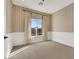 Bedroom with window, neutral wall colors and wainscoting at 9472 Ojibwa Ave, Las Vegas, NV 89149