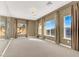 Bright bedroom with large windows and neutral carpeting at 9472 Ojibwa Ave, Las Vegas, NV 89149