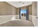 Bright bedroom with window and blue curtains at 9472 Ojibwa Ave, Las Vegas, NV 89149
