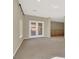 Bright bonus room with balcony access and neutral carpeting at 9472 Ojibwa Ave, Las Vegas, NV 89149