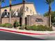 Gated community entrance with landscaping and signage at 9472 Ojibwa Ave, Las Vegas, NV 89149