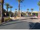 Gated entrance to the community with palm trees and security at 9472 Ojibwa Ave, Las Vegas, NV 89149