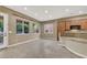 Kitchen and dining area with tile floors and lots of natural light at 9472 Ojibwa Ave, Las Vegas, NV 89149