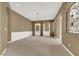 Formal dining room with neutral walls and large windows at 9472 Ojibwa Ave, Las Vegas, NV 89149