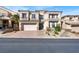 Two-story house with a three-car garage and landscaping at 9472 Ojibwa Ave, Las Vegas, NV 89149