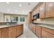 Bright kitchen, granite counters, and wood cabinets at 9472 Ojibwa Ave, Las Vegas, NV 89149