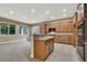 Eat-in kitchen with island and wood cabinets at 9472 Ojibwa Ave, Las Vegas, NV 89149