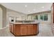 Open kitchen with large island and granite countertops at 9472 Ojibwa Ave, Las Vegas, NV 89149