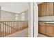 Upstairs laundry room with wooden cabinets and granite countertops at 9472 Ojibwa Ave, Las Vegas, NV 89149
