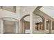 Spacious living room with high ceilings and arched doorways at 9472 Ojibwa Ave, Las Vegas, NV 89149