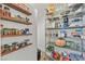 Well-organized pantry with wood shelves and wire racks, offering ample storage at 9668 Padre Peak Ct, Las Vegas, NV 89178