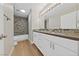 Modern bathroom with dual vanity, updated fixtures and tile at 1009 Beaver Crest Ter, Henderson, NV 89015