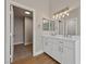 Elegant bathroom with double vanity and updated lighting at 1009 Beaver Crest Ter, Henderson, NV 89015