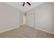 Well-lit bedroom with plush carpeting and a ceiling fan at 1009 Beaver Crest Ter, Henderson, NV 89015