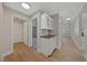 Clean hallway with light wood flooring and built-in storage at 1009 Beaver Crest Ter, Henderson, NV 89015