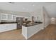 Open concept kitchen with island and stainless steel appliances at 1009 Beaver Crest Ter, Henderson, NV 89015