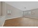 Light-filled living room showcasing hardwood floors and plantation shutters at 1009 Beaver Crest Ter, Henderson, NV 89015