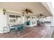 Covered patio with table, chairs, and ceiling fans at 1010 Legacy Dr, Boulder City, NV 89005