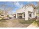 Landscaped backyard with covered patio and water feature at 1010 Legacy Dr, Boulder City, NV 89005