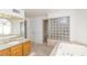 Bathroom with double vanity, soaking tub and shower at 1010 Legacy Dr, Boulder City, NV 89005