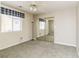 Bright bedroom with mirrored closet doors and window coverings at 1010 Legacy Dr, Boulder City, NV 89005